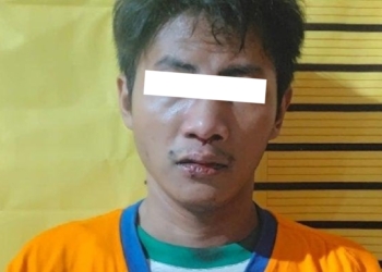 Tersangka berinisial MMH (27) saat diamankan di Mapolsek Tambaksari Surabaya /Istimewa